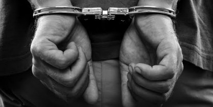 monochrome-man-handcuffs Tax Evasion